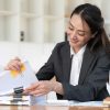 Document automation for law firms concept image - a female lawyer sorting through documents