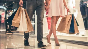Consumer habits and behaviours - a couple shopping at a mall
